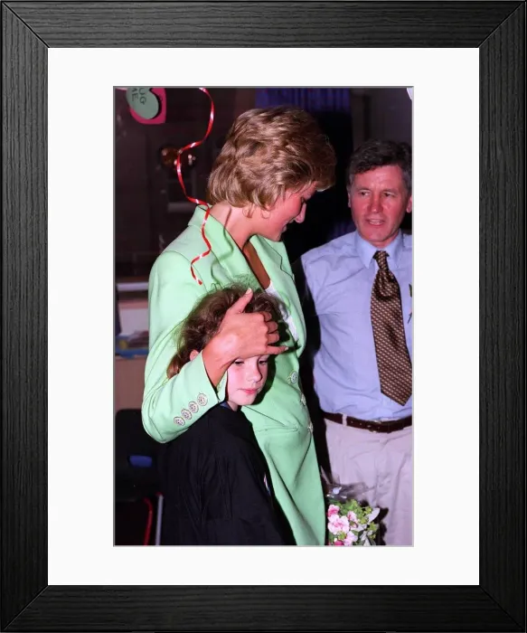 Framed Print : Diana, Princess of Wales with her arm round Danielle Stephenson on avisit to a