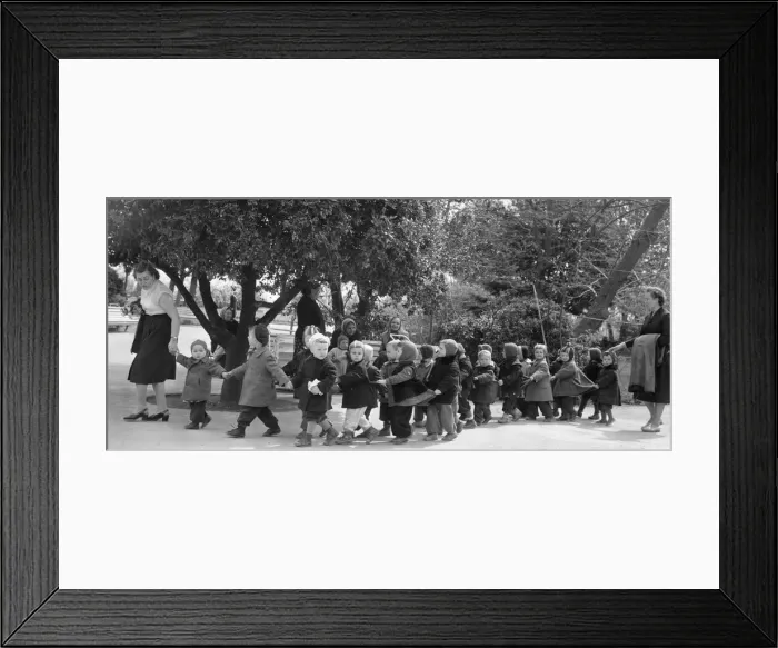 Framed Print : Kindergarten teachers lead their young charges though a Yalta park in the USSR Framed Print : Kindergarten teachers lead their young charges though a Yalta park in the USSR