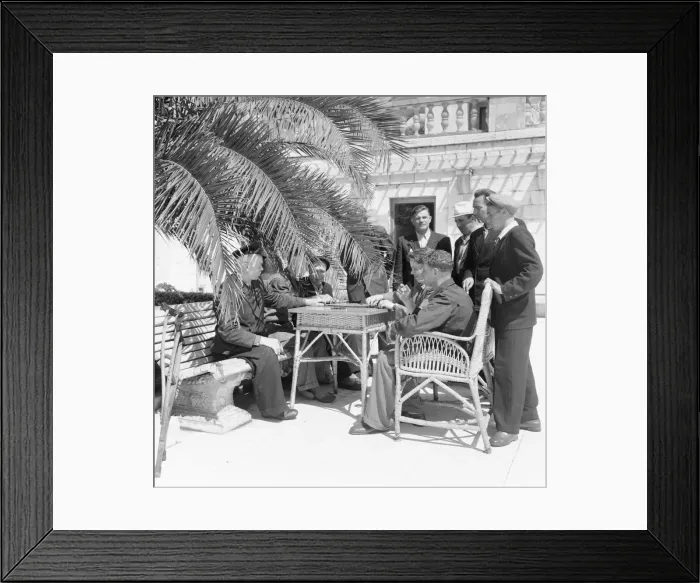 Framed Print : Russian holiday makers seen playing domimoes under the shade of a palm tree Framed Print : Russian holiday makers seen playing domimoes under the shade of a palm tree