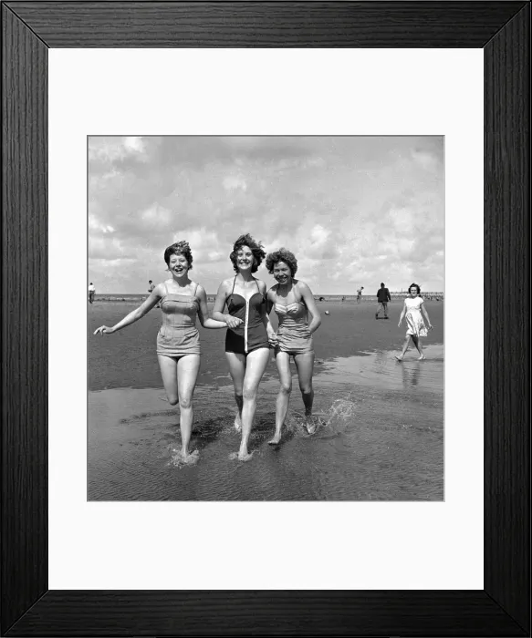 Framed Print : Girls in swimsuits running on the beach at Blackpool. 5th August 1958 Framed Print : Girls in swimsuits running on the beach at Blackpool. 5th August 1958
