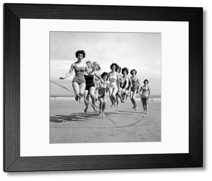 Framed Print : Beauty contest girls playing on the beach at Newquay. 7th July 1960