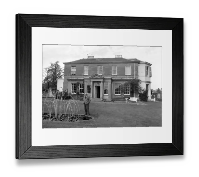 Framed Print : Novelist J. B. Priestley in the garden of his home, Kissing Tree House in the village of