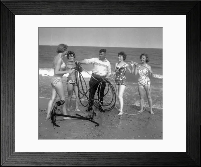 Framed Print : Beauty contest girls playing at Gt. Yarmouth, UK. seen here with a local fisherman