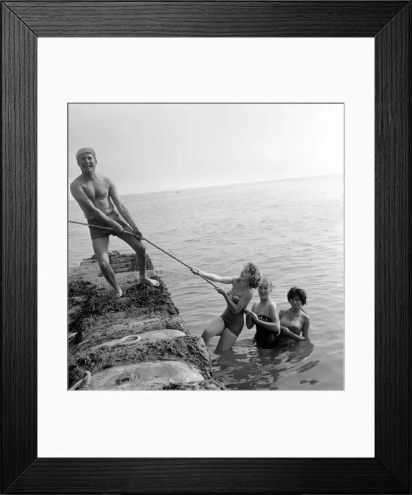Framed Print : Beauty contest contestant seen here playing a game of tug of war with the shows compaere Framed Print : Beauty contest contestant seen here playing a game of tug of war with the shows compaere