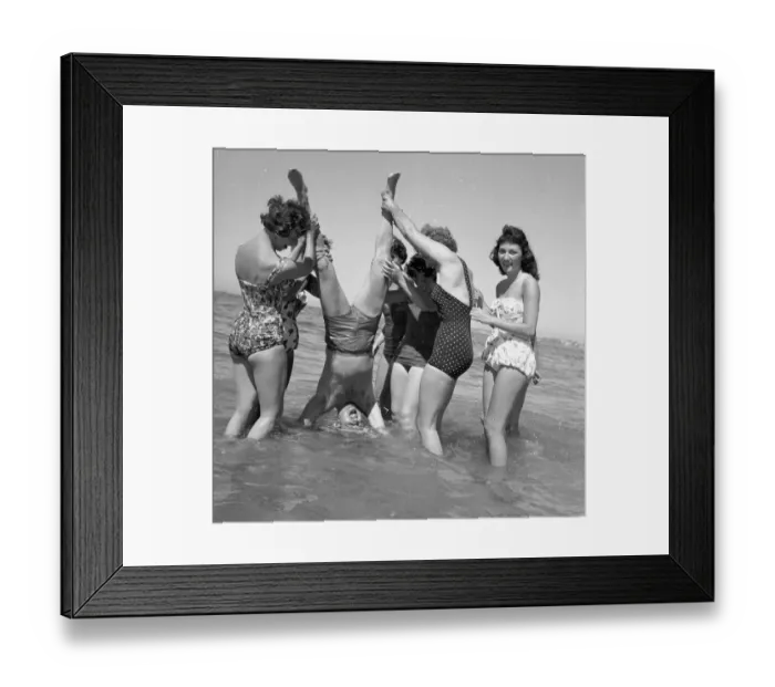 Framed Print : Beauty contest girls playing on the beach at Sandbanks with the compere of Framed Print : Beauty contest girls playing on the beach at Sandbanks with the compere of