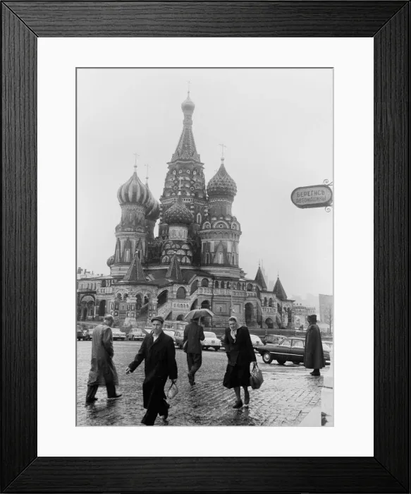 Framed Print : Moscovites with their heads down against the rain seen here passing St Basil Framed Print : Moscovites with their heads down against the rain seen here passing St Basil