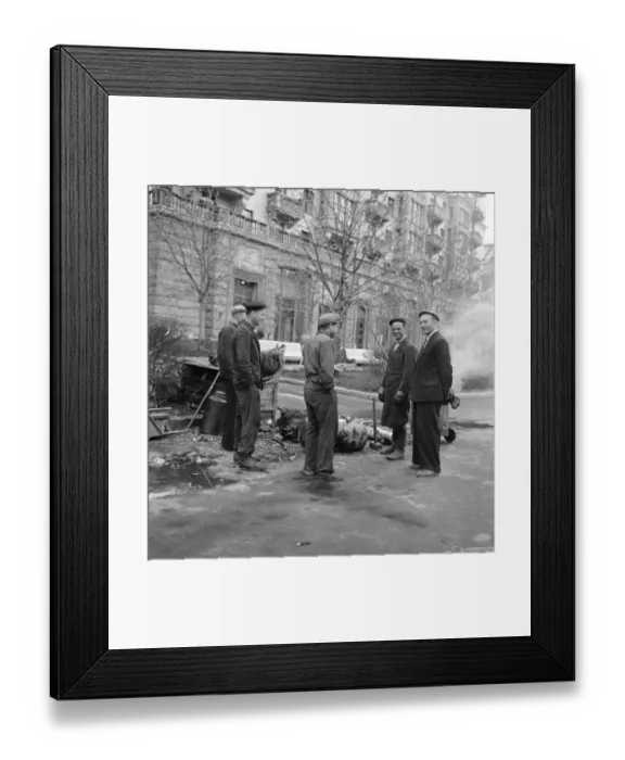 Framed Print : Street cleaners take a cigarette break while at work in one of the residential streets in