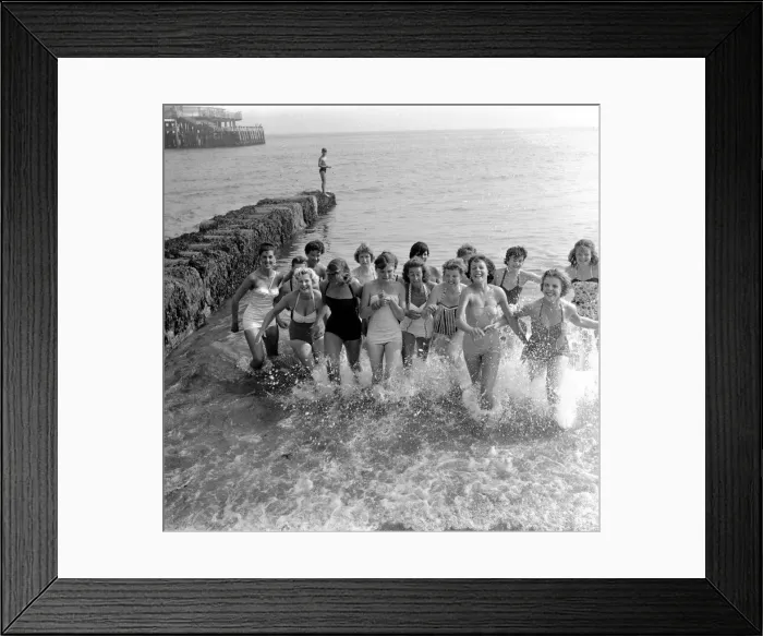 Framed Print : Beauty contest contestant seen here playing in the sea at Ventnor, UK Framed Print : Beauty contest contestant seen here playing in the sea at Ventnor, UK