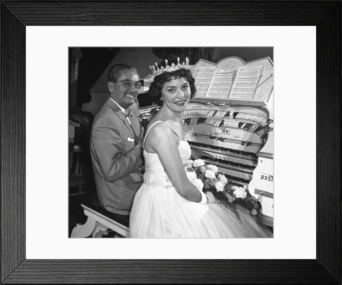 Framed Print : Young bride sitting at a wurliitz organ with musician for her wedding ceremony Framed Print : Young bride sitting at a wurliitz organ with musician for her wedding ceremony