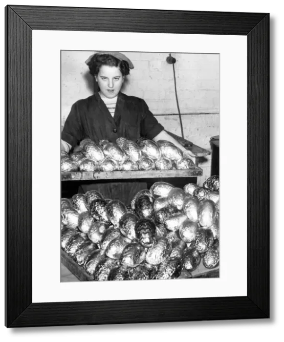 Framed Print : Mary Timney brings out a finished tray of eggs, which are wrapped Framed Print : Mary Timney brings out a finished tray of eggs, which are wrapped