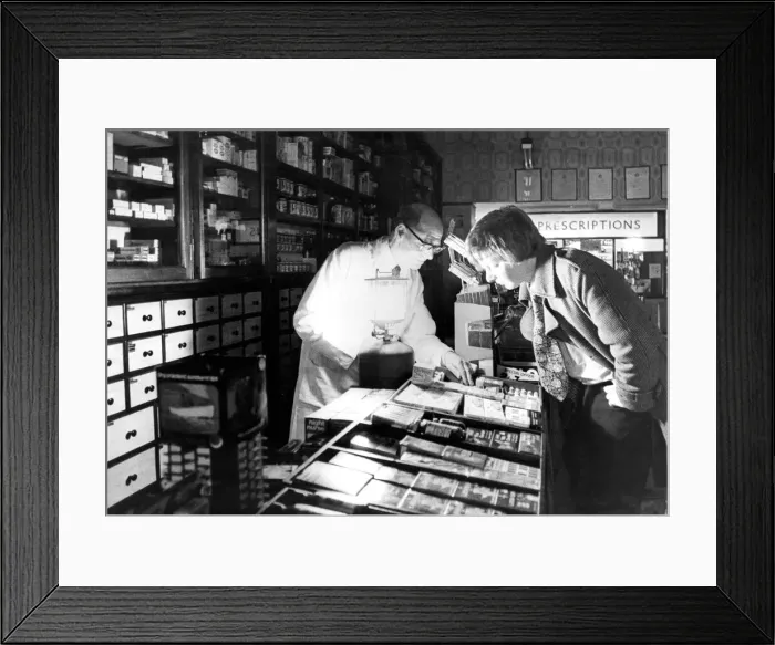 Framed Print : Mr. James Taylor maintaining essential services by emergency lighting in a pharmacy Framed Print : Mr. James Taylor maintaining essential services by emergency lighting in a pharmacy