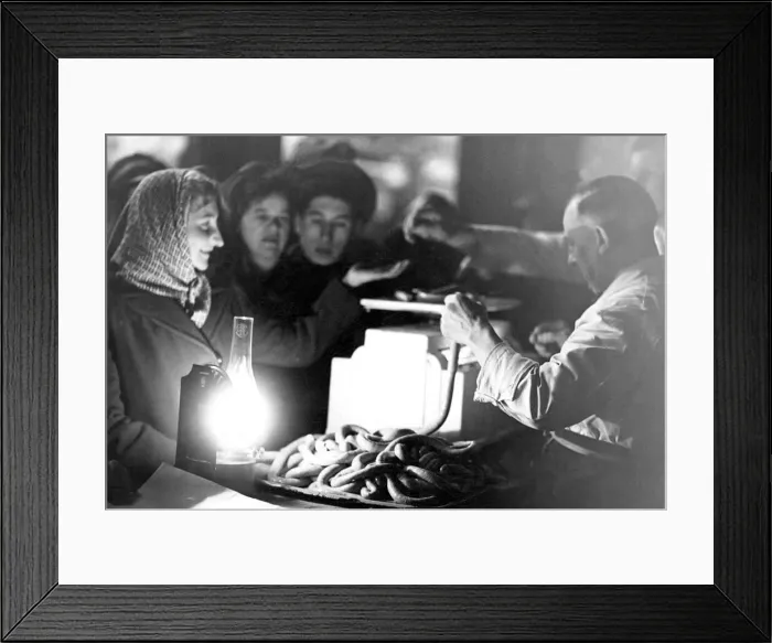 Framed Print : An oil lamp provides illumination at a butchers stall in the Newcastle Grainger Market