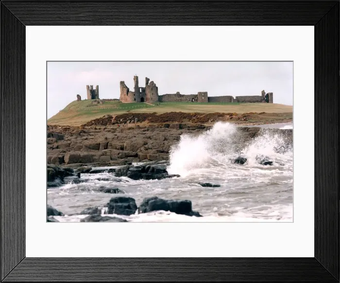 Framed Print : The remote and impressive ruins of Northumberlands Dunstanburgh Castle in July 1996 Framed Print : The remote and impressive ruins of Northumberlands Dunstanburgh Castle in July 1996