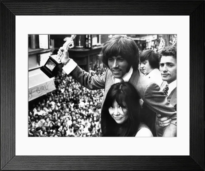 Framed Print : Barry Gibb of the Bee Gees holding the John Stephen statuette presented to him by Miss Framed Print : Barry Gibb of the Bee Gees holding the John Stephen statuette presented to him by Miss