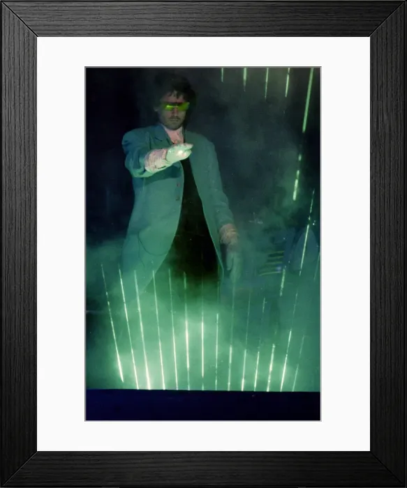 Framed Print : French composer and performer Jean Michel Jarre seen here on stage playing a laser harp Framed Print : French composer and performer Jean Michel Jarre seen here on stage playing a laser harp