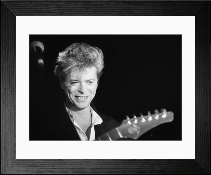 Framed Print : David Bowie seen here singing at the press conference to announce the details of his