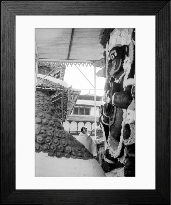 Framed Print : A woman seen here looking at a depiction of a Hindu god on the facade of a Hindu temple