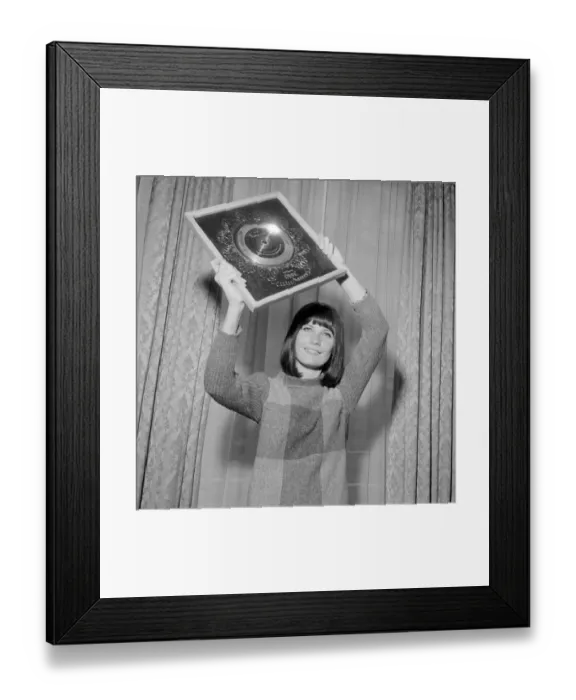 Framed Print : Pop singer Sandie Shaw holding the Silver Disc award for selling 250 000 copies of her
