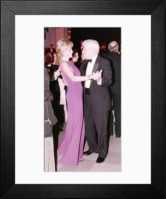 Framed Print : Princess Diana dances with American chat show host Phil Donahue at a charity gala dinner Framed Print : Princess Diana dances with American chat show host Phil Donahue at a charity gala dinner