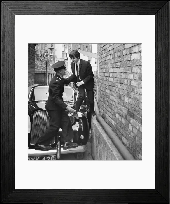 Framed Print : Paul McCartney is helped as limo gets stuck at entrance to Futurist theatre in