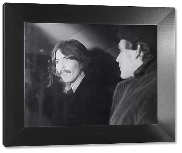 George Harrison and Beatles aide Neil Aspinall leave the New London Synagogue, St