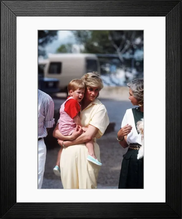 Framed Print : Princess Diana holds her young son Prince Harry on holiday in Majorca, Spain