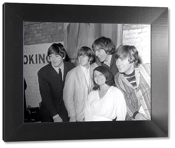 The Beatles backstage at the Futurist theatre in Scarborough with Cherry Rowland one of