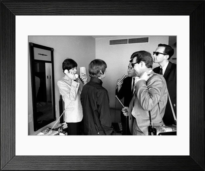 Framed Print : Ringo Starr talks to reporters and Paul McCartney talks on the phone August 1964 Framed Print : Ringo Starr talks to reporters and Paul McCartney talks on the phone August 1964