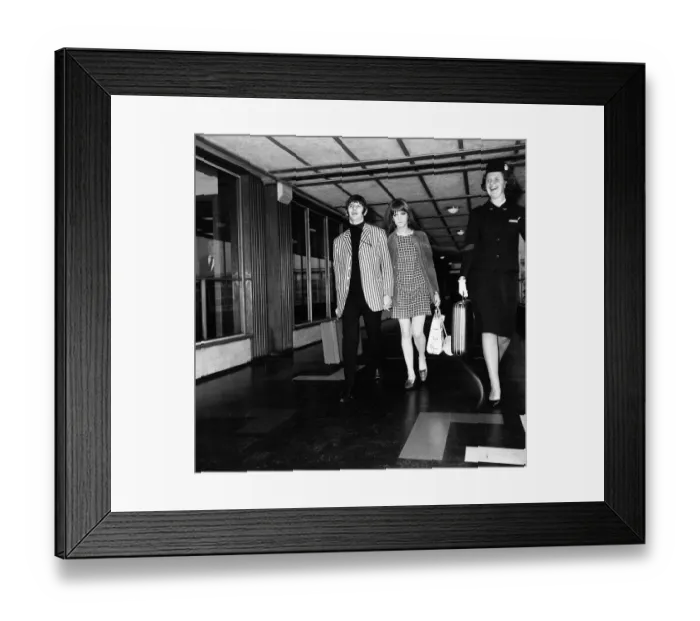Framed Print : Beatles drummer Ringo Starr and wife Maureen at Heathrow Airport before leaving for a two
