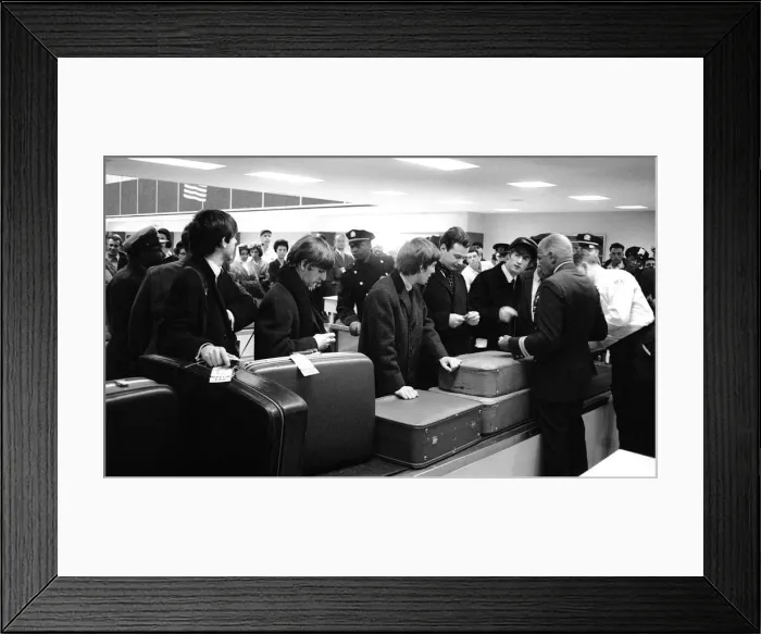 Framed Print : The Beatles and manger Brian Epstein waiting for their luggage after arriving in New York Framed Print : The Beatles and manger Brian Epstein waiting for their luggage after arriving in New York