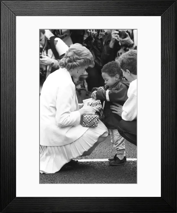Framed Print : Princess Diana handing out a few surprise gifts to children at the start of the 1988
