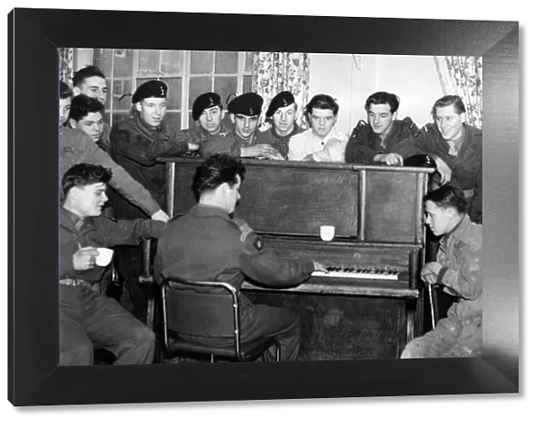 These young recruits liked to have a sing song round the piano in the N. A. A. F. I. club