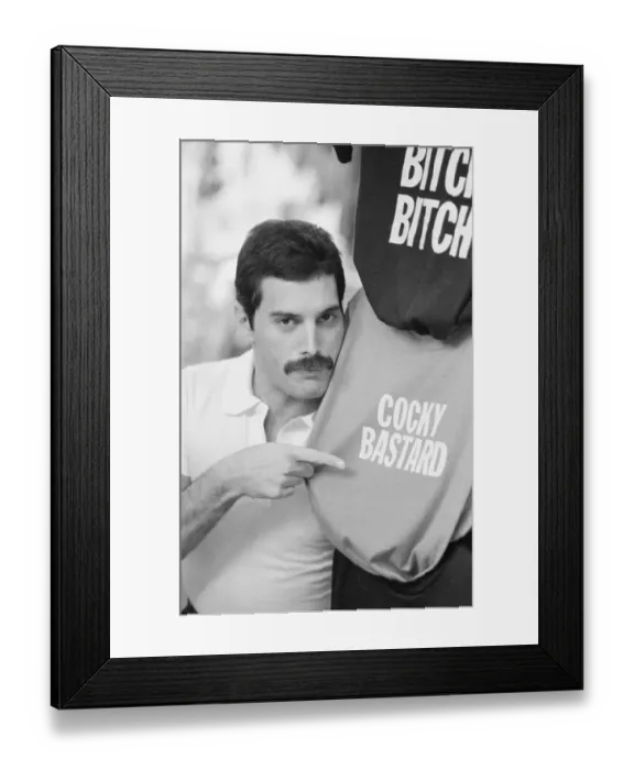 Framed Print : Queen lead singer Freddie Mercury seen here out shopping in a street market in New Framed Print : Queen lead singer Freddie Mercury seen here out shopping in a street market in New
