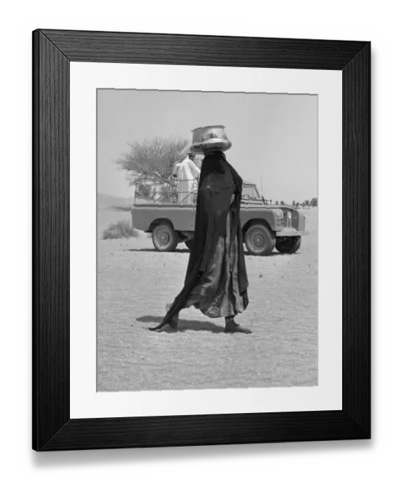 Framed Print : A bedouin woman seen here wearing traditional dress collecting water. July 1965
