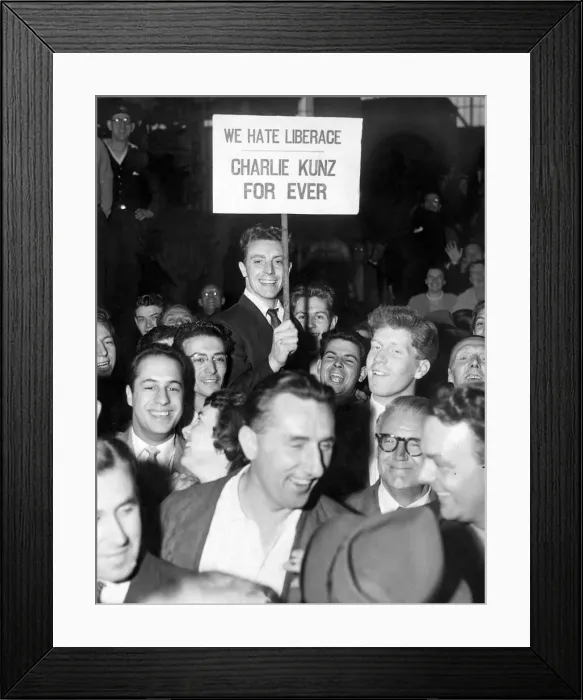 Framed Print : Liberace arrives in London and an opposition group, the nucleus of which was a band of Framed Print : Liberace arrives in London and an opposition group, the nucleus of which was a band of