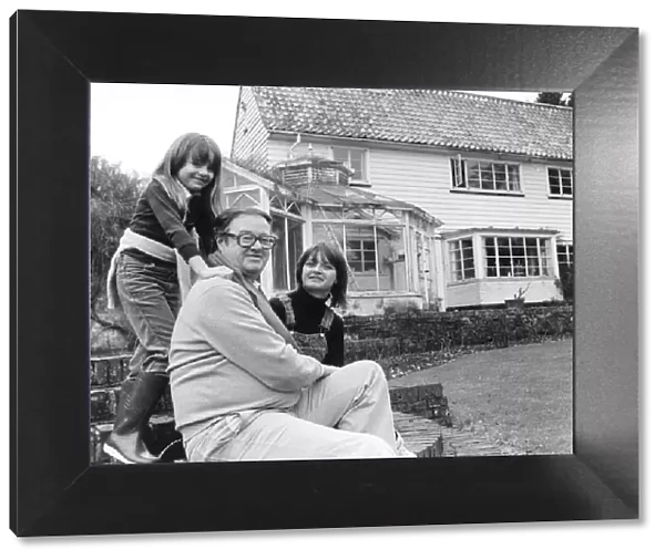 John Mortimer QC with his wife Penny and seven year old daughter Emily at their home in