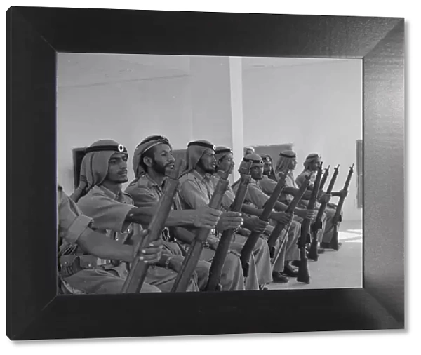Members of the Abu Dhabi defence force pose for the camera in the grounds of the Royal