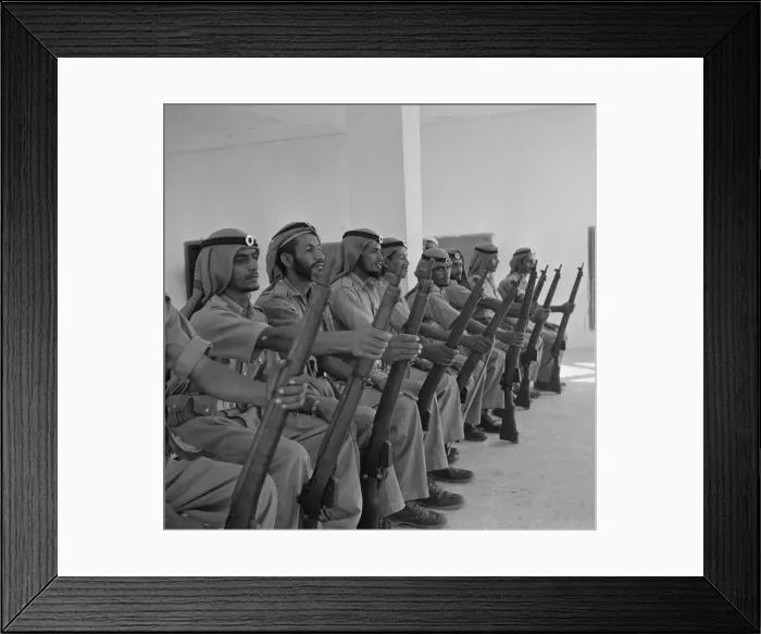 Framed Print : Members of the Abu Dhabi defence force pose for the camera in the grounds of the Royal Framed Print : Members of the Abu Dhabi defence force pose for the camera in the grounds of the Royal