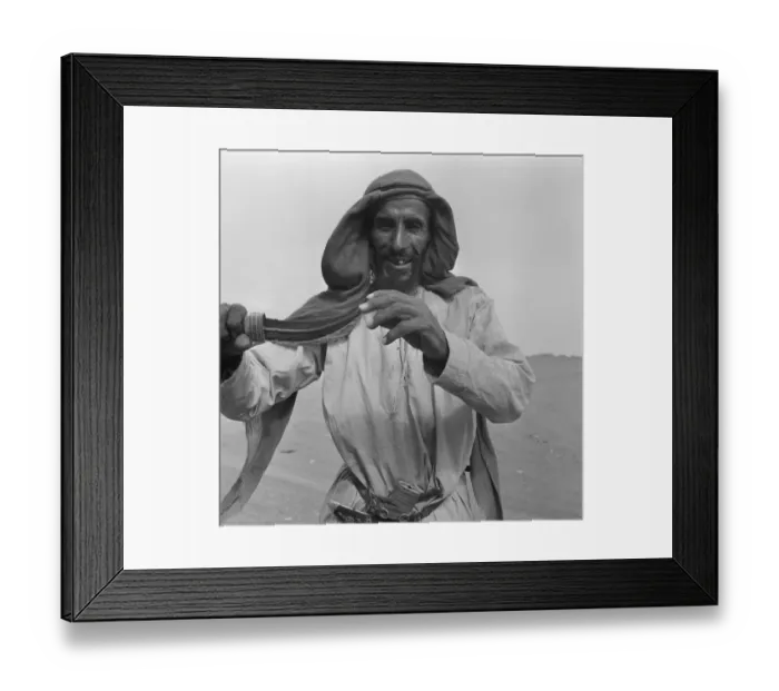 Framed Print : A camel herder seen here showing off his dagger, in Abu Dhabi. July 1965 U6027