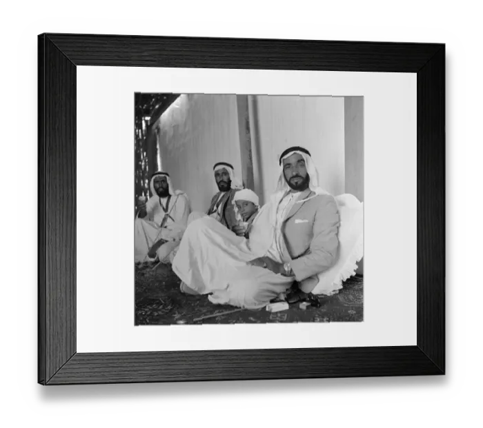 Framed Print : Members of the ruling Al Nayhan family seen here enjoying tea in the place just outside Framed Print : Members of the ruling Al Nayhan family seen here enjoying tea in the place just outside
