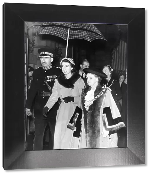 Queen Elizabeth II visits Sunderland with Mayor Jane Huggins sheltering from the rain