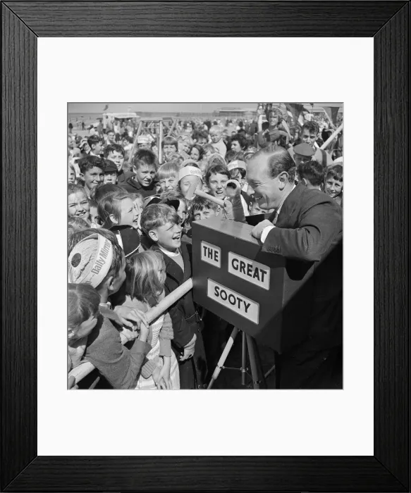 Framed Print : Harry Corbett and Sooty mobbed by fans at the Daily Mirror Beach party. August 1958