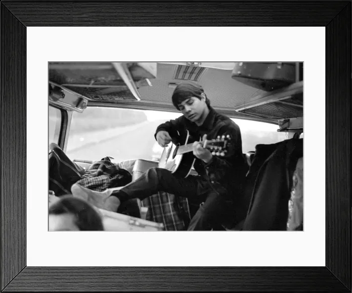 Framed Print : Pop group The Fourmost on tour Bertie Higgins of the Roemans group practices guitar Framed Print : Pop group The Fourmost on tour Bertie Higgins of the Roemans group practices guitar
