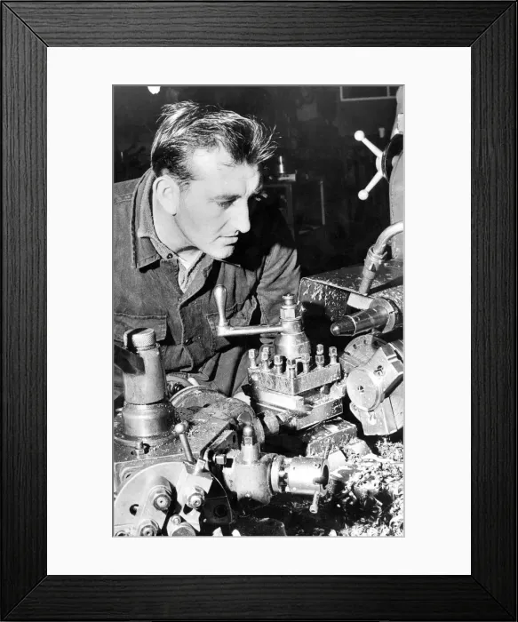 Framed Print : A factory worker in an engineering firm in 1972
