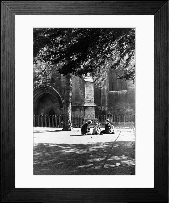 Framed Print : Childhood confidences in the playground of the girls school beside the walls of Tewesbury