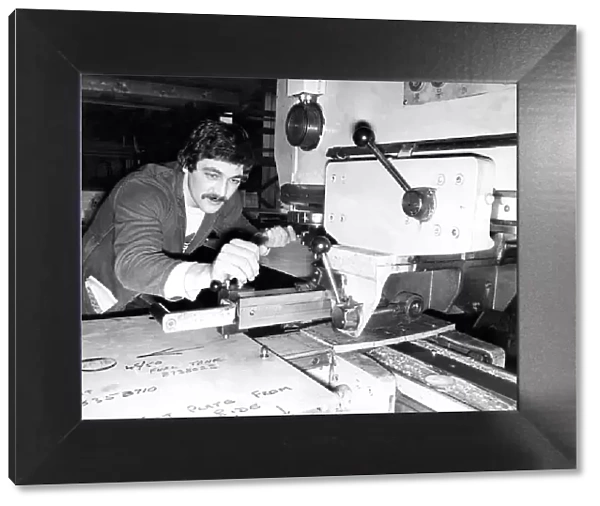 Ronnie Metcalf operates a nibbler in a factory in 1980
