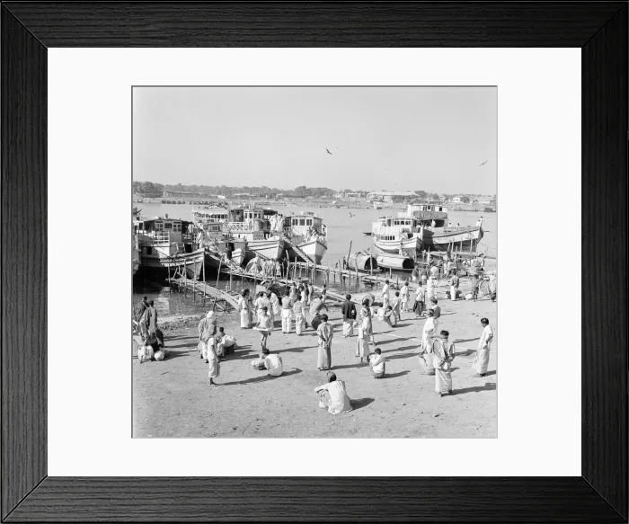Framed Print : Locals wait to board ferryboats that crowd the harbour in Dacca, Bangladesh Framed Print : Locals wait to board ferryboats that crowd the harbour in Dacca, Bangladesh