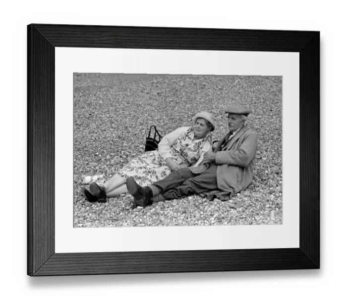 Framed Print : Elderly couple sunbathing on the pebble beach at Brighton July 1958 Framed Print : Elderly couple sunbathing on the pebble beach at Brighton July 1958