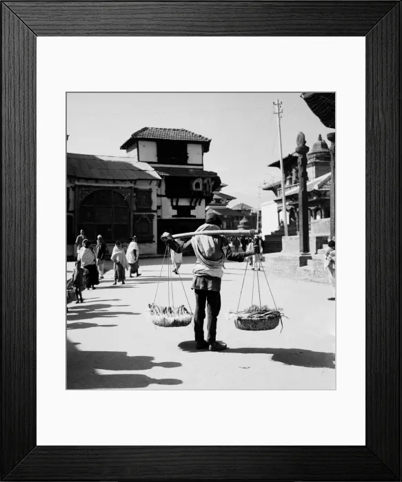 Framed Print : A Nepalese market trader seen here carrying his onions to market in Durbar Square