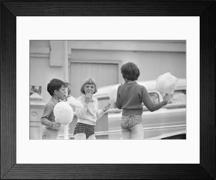 Framed Print : Children enjoying candyfloss from a stall on the seafront at Brighton July 1958